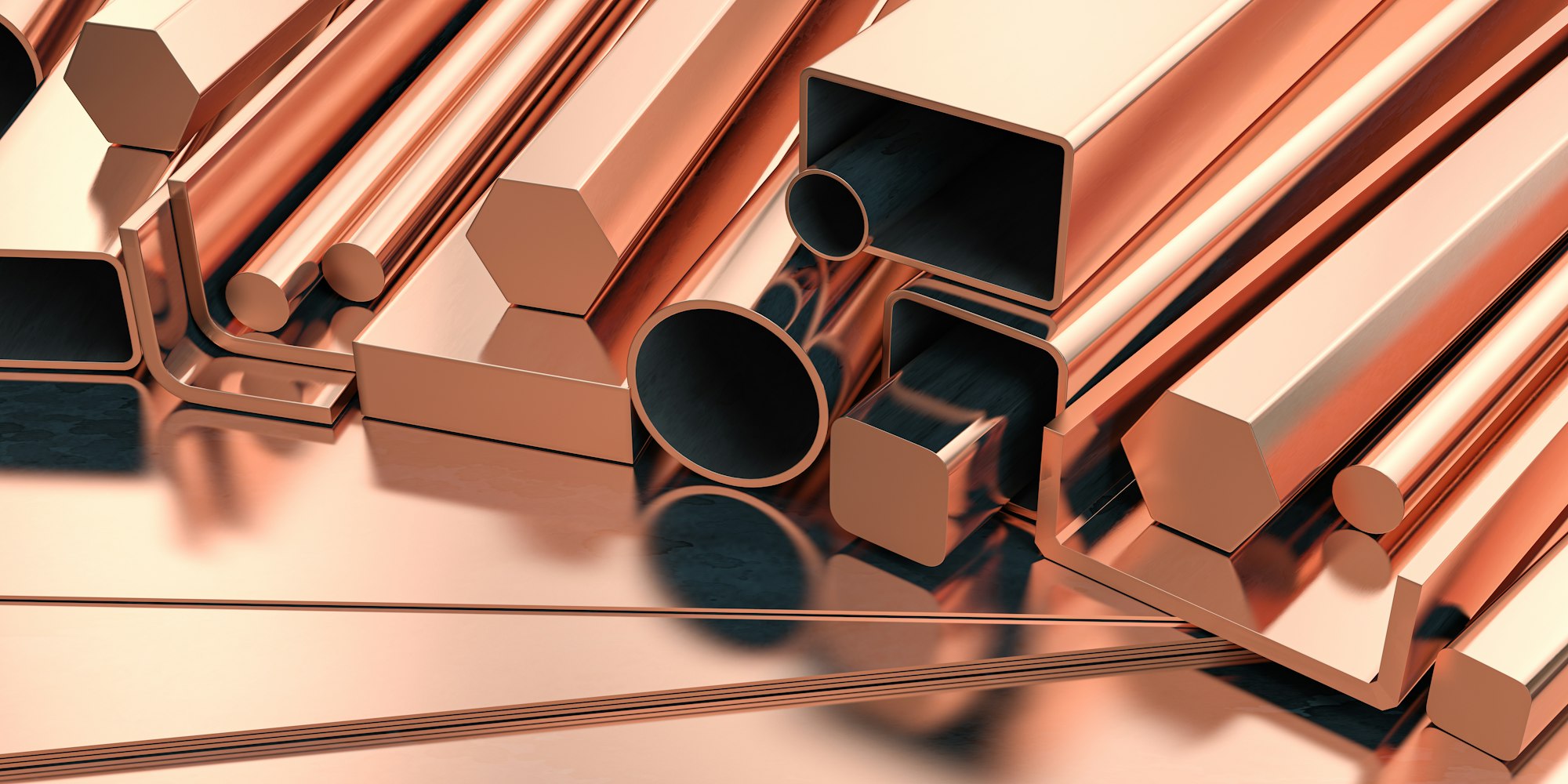Copper tubes and different profiles in warehouse background. Different copper metal rolled products.